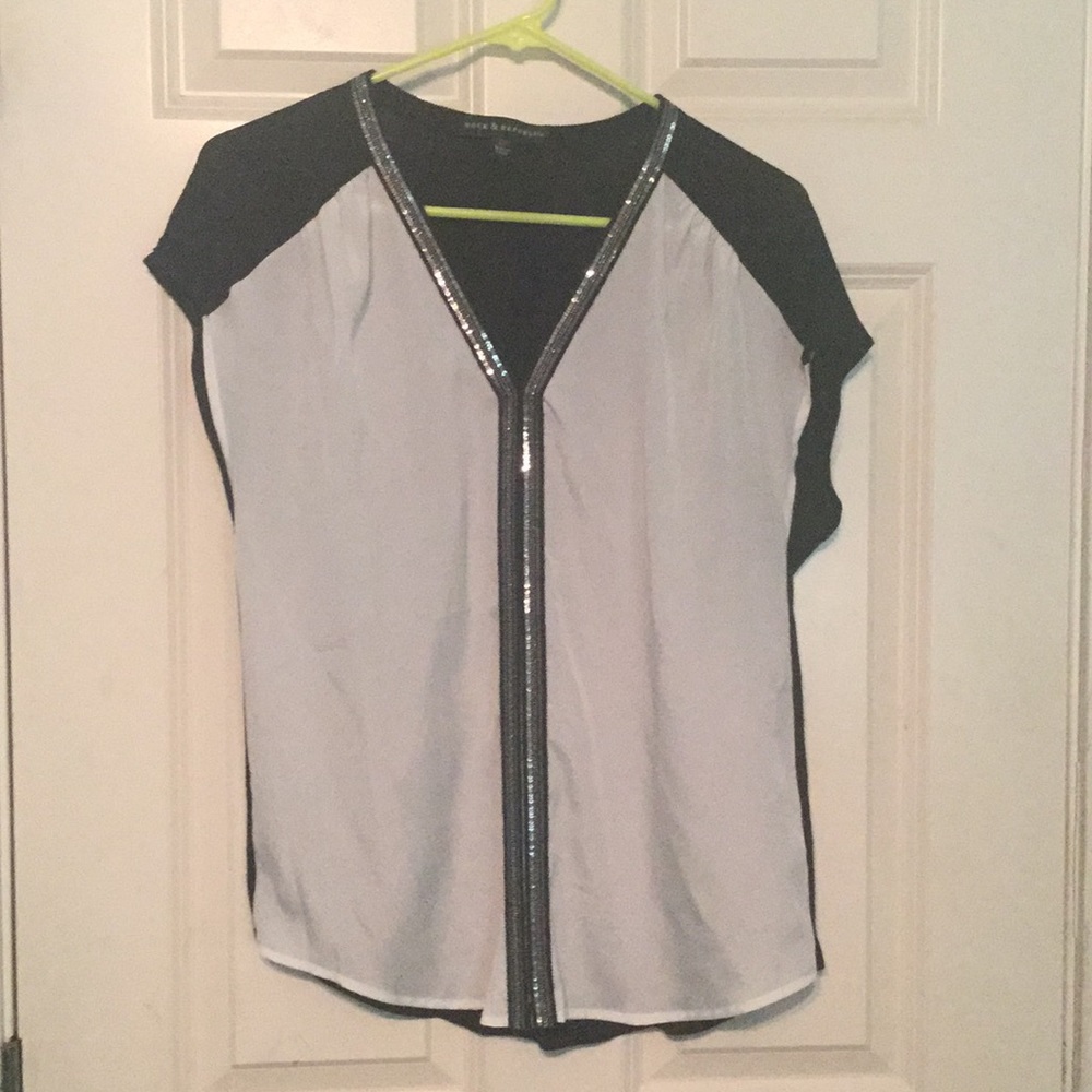 White/black top with metallic detail